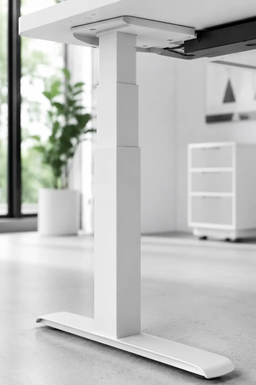 Dual motor telescoping leg columns of an adjustable electric standing desk close up