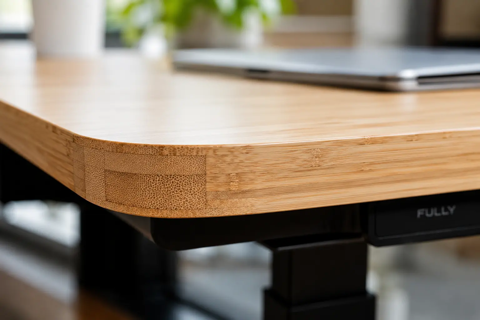Fully Jarvis electric standing desk sustainable bamboo wood desktop surface detail close up