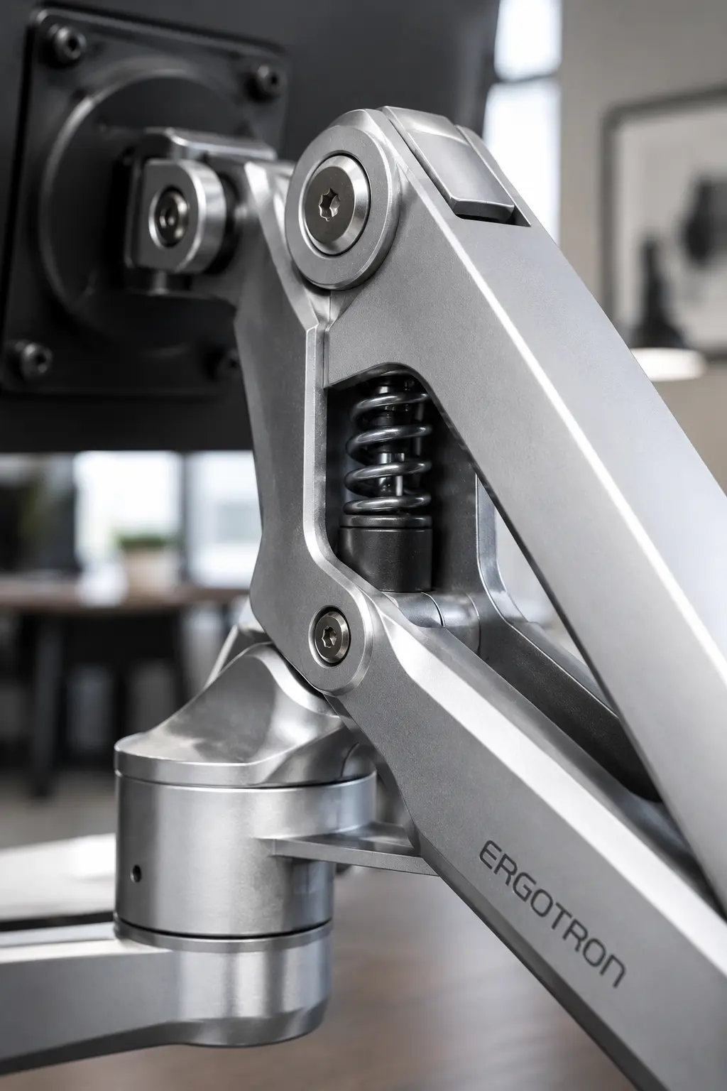 Polished aluminum articulation joint of Ergotron LX dual monitor arm close up