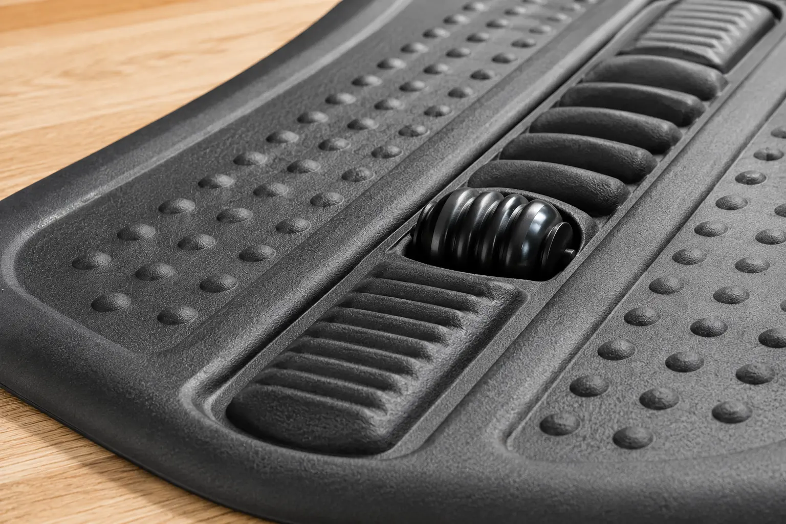 Close up on the premium polyurethane topographical ridges of a Topo standing desk mat