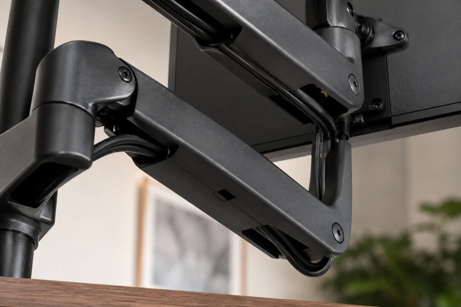 HUANUO heavy duty monitor arm plastic cable management slide routing channels close up