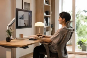Side view of a remote worker sitting with a healthy open hip angle recline posture