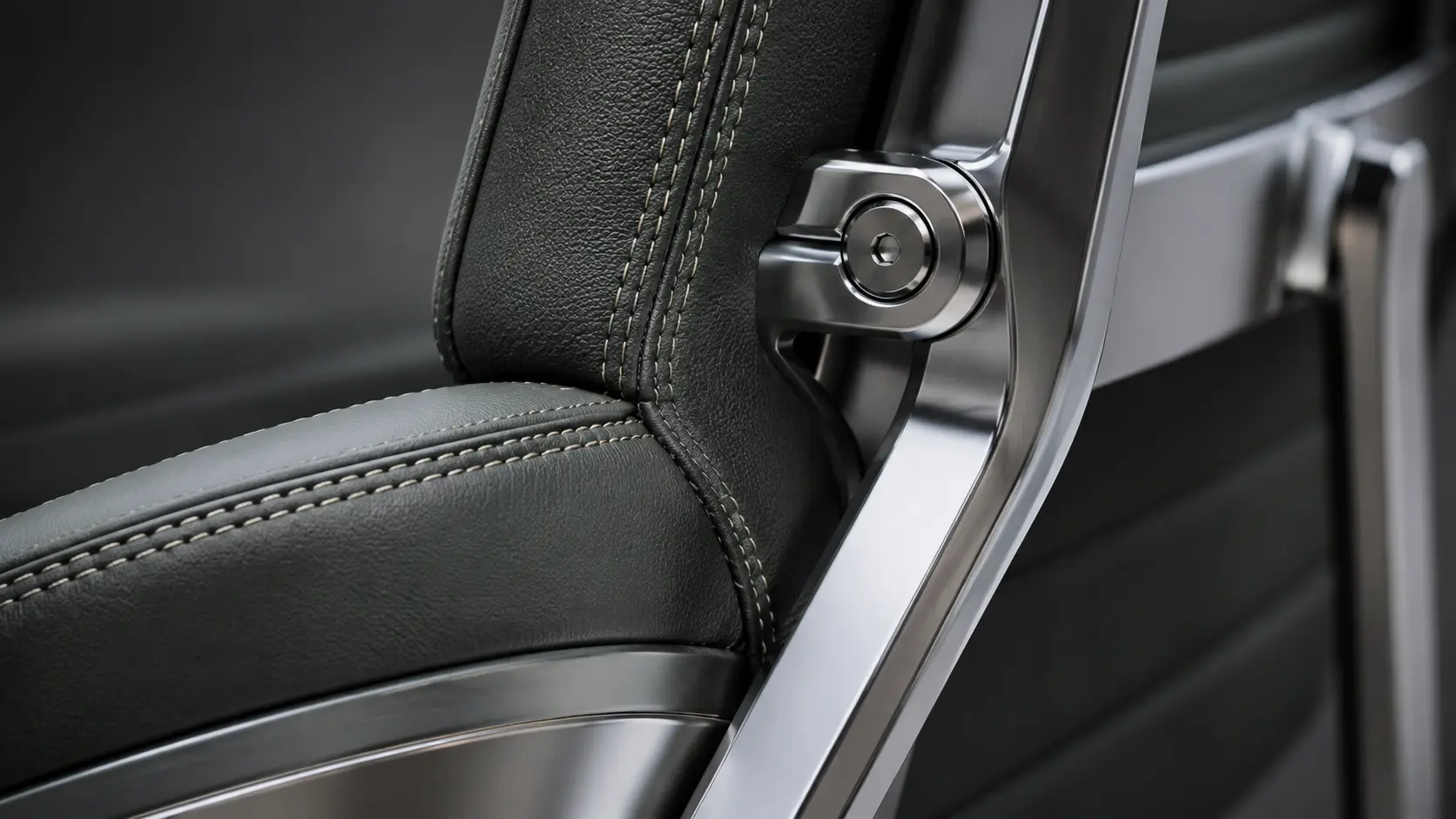 Macro Detail of Premium Full-Grain Napa Leather and Polished Cast Aluminum Joints on an Executive Task Chair